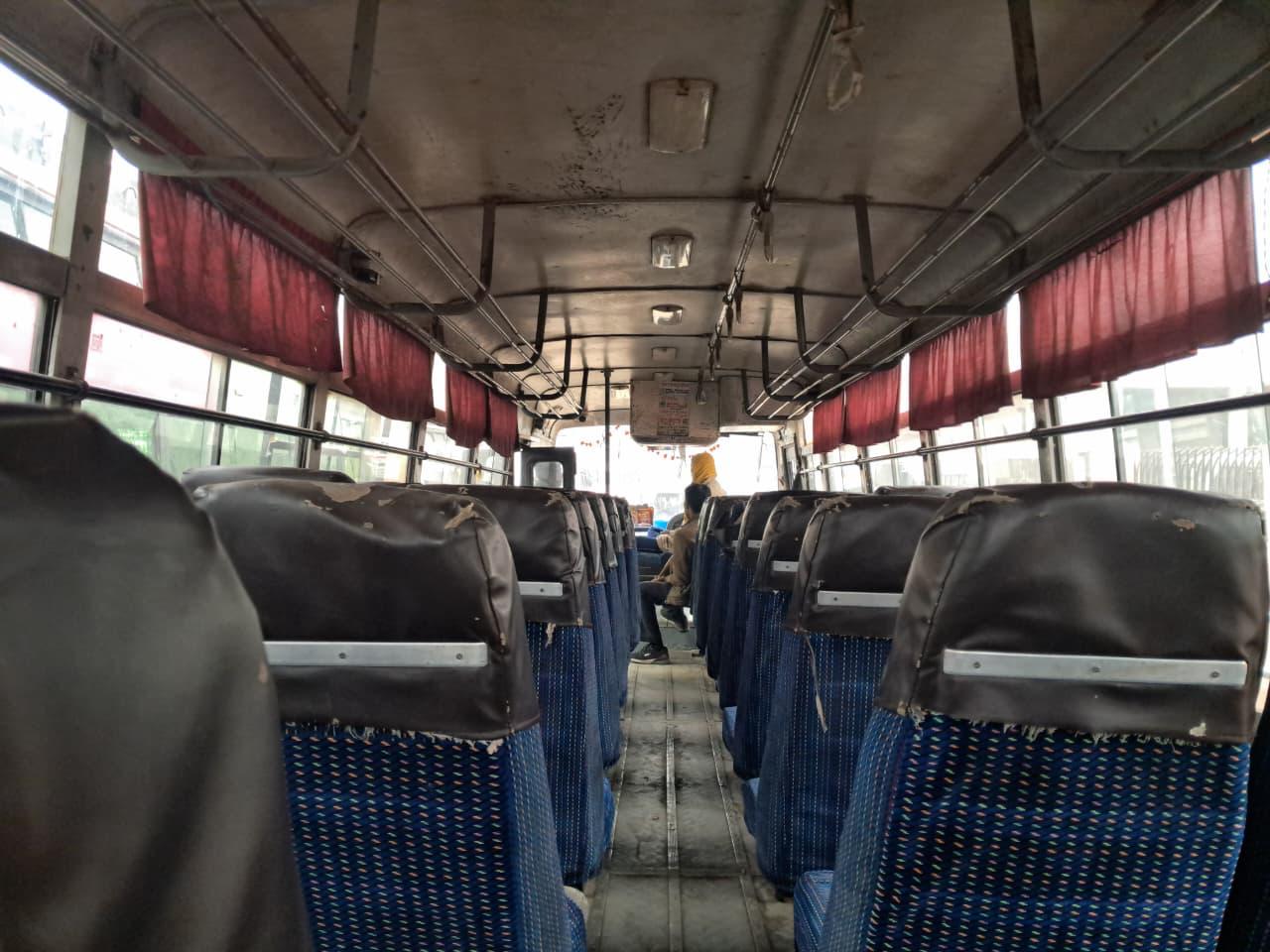 Interior with red curtains, older bus