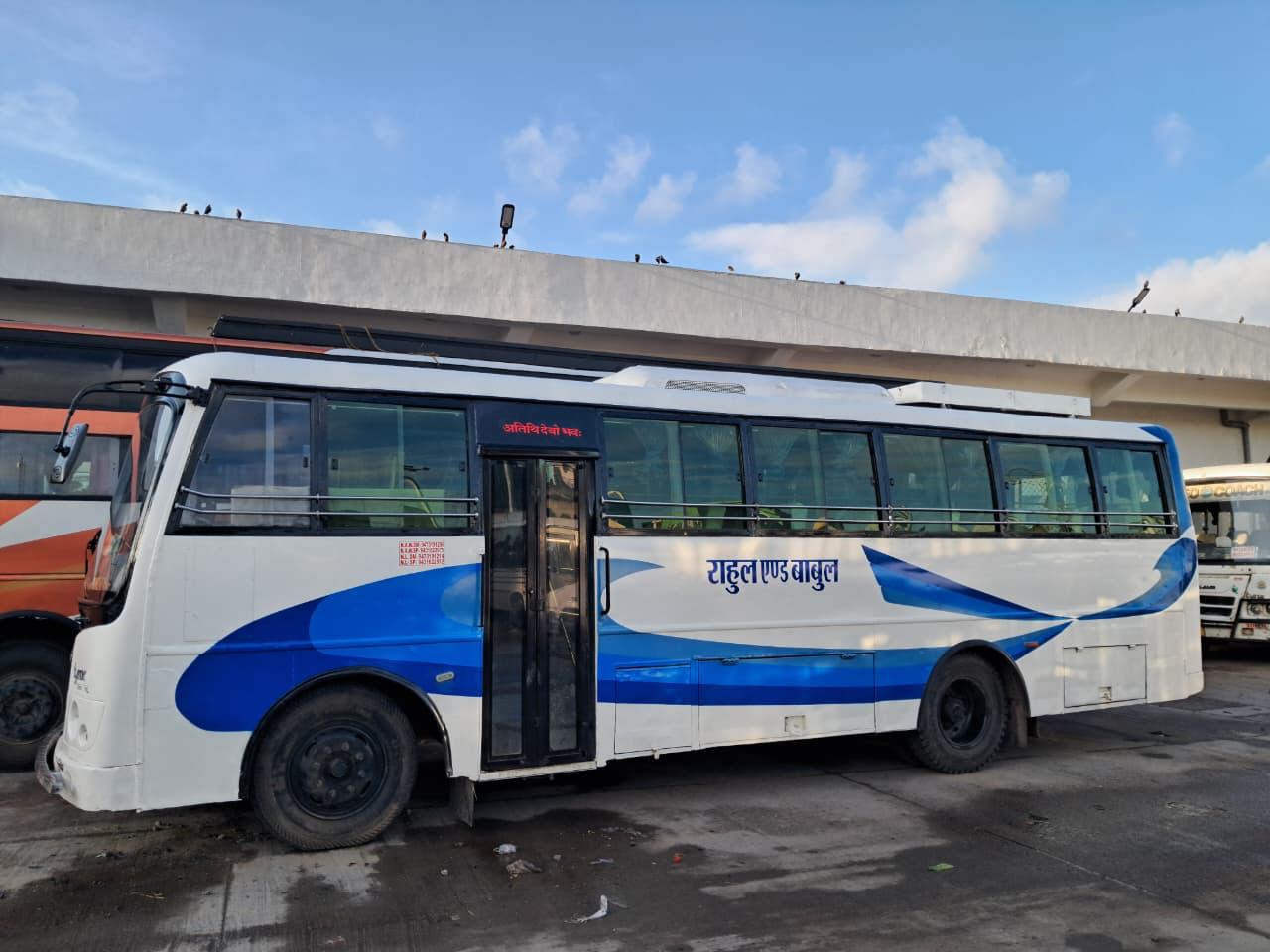 Bus side view with blue wave livery